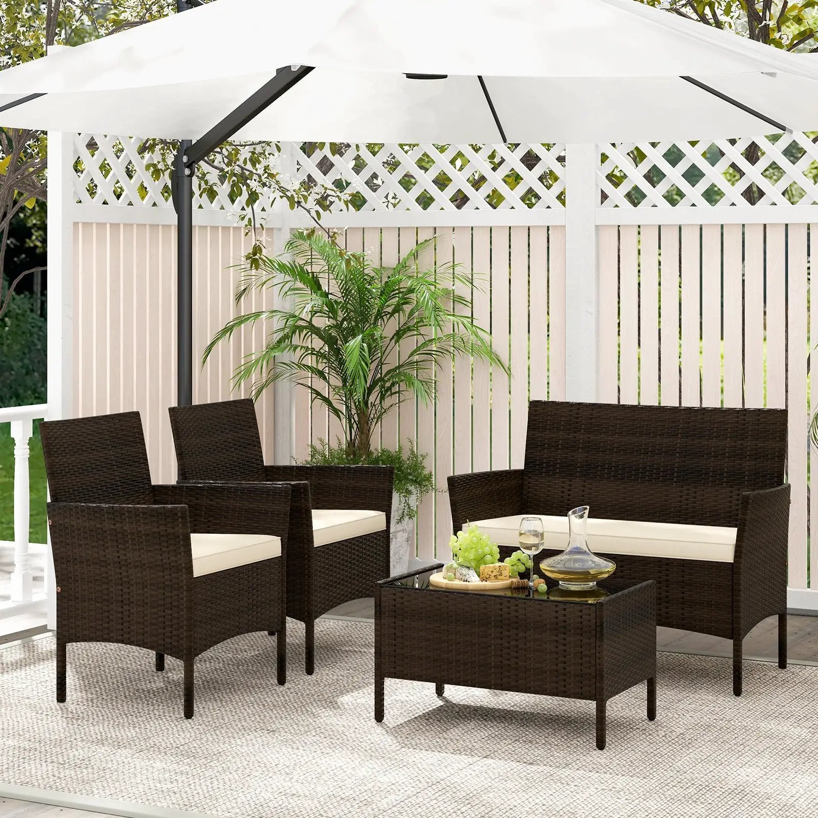 4 Piece Patio Rattan Conversation Set with Cozy Seat Cushions by DirectDeals
