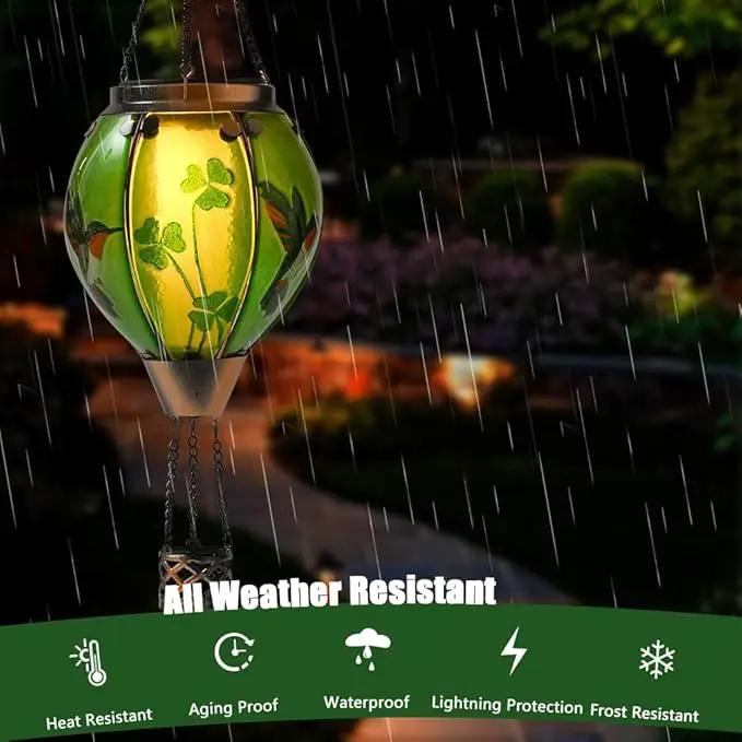St Patricks Hot Air Balloon Solar Lantern - Simulated Flickering Flame Patrick's Shamrock Glass Lantern, Outdoor Hummingbird Hanging Yard Light for St Patty's Day Patio Porch Decor Clover Gfit by GreenHaven Gardens