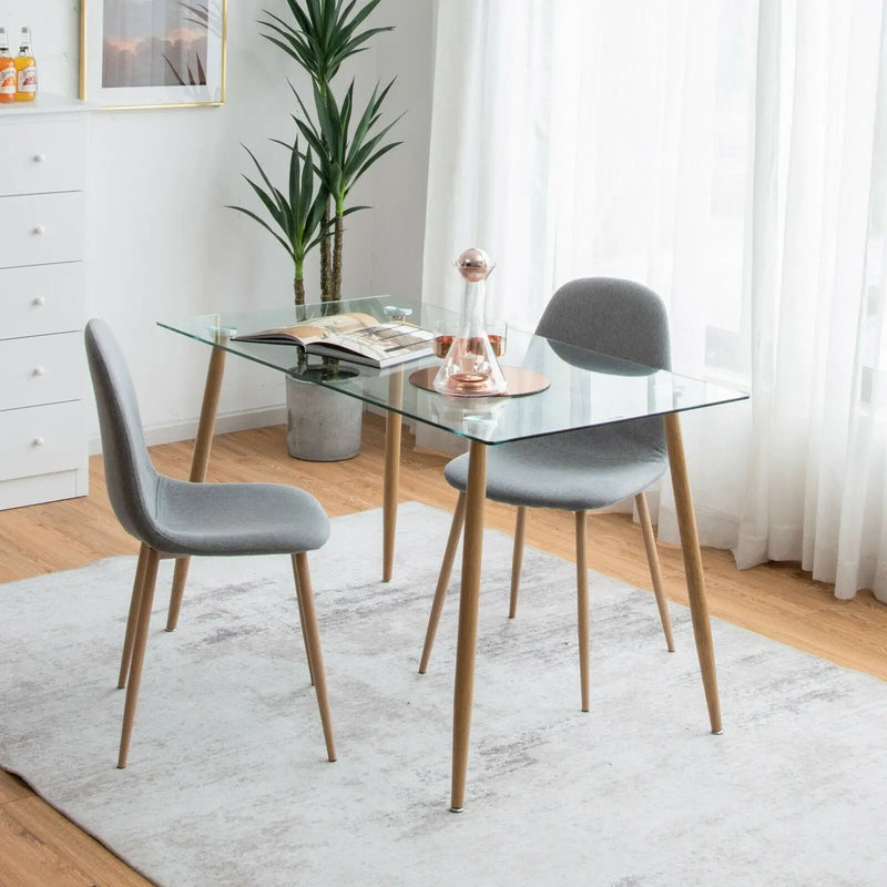 Modern Glass Rectangular Dining Table with Metal Legs by DirectDeals