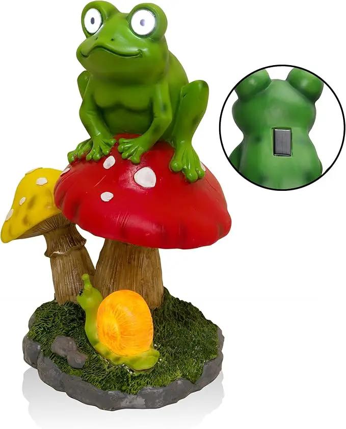 Alpine Corporation ZEN390SLR-S Frog on Mushroom Statue with LED Lights, Solar-Powered LED Frog Garden Statue, 12" H, Green by GreenHaven Gardens