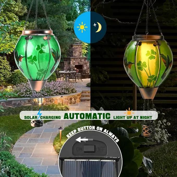 St Patricks Hot Air Balloon Solar Lantern - Simulated Flickering Flame Patrick's Shamrock Glass Lantern, Outdoor Hummingbird Hanging Yard Light for St Patty's Day Patio Porch Decor Clover Gfit by GreenHaven Gardens