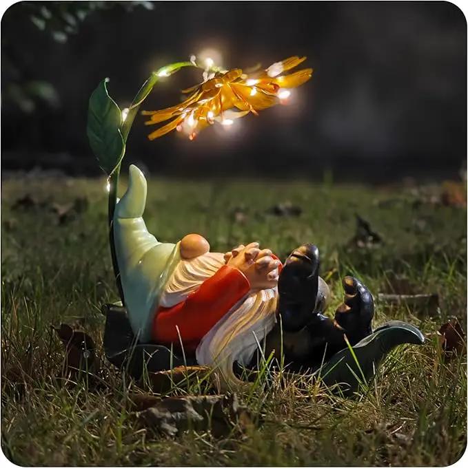 Solar Powered Gnome Garden Statue - Resin Gnome on Green Leaf with Large Yellow Stamen Sunshade, LED Lights Decorations, for Women Men, Outdoor Decor Ornaments for Outside by GreenHaven Gardens