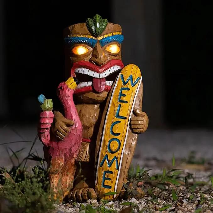 Welcome Tiki Statue with Surfboard Flamingo-Solar Outdoor Decor - Tiki Man with Automatic Switch On Flickering Eyes LED Light for Tiki Bar Decorations, Patio, Balcony, Yard,Lawn,Gifts by GreenHaven Gardens