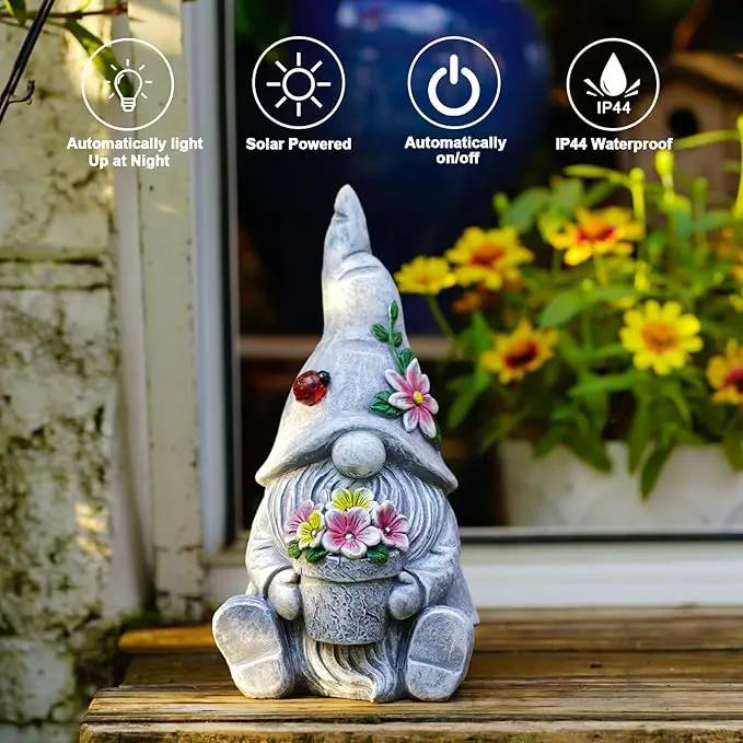 Goodeco Sitting Gnome Holding Flower Statue - Solar Garden Gnomes Decor for Outside with LED Lights, for Women or Moms, Housewarming Gnome Decorations by GreenHaven Gardens