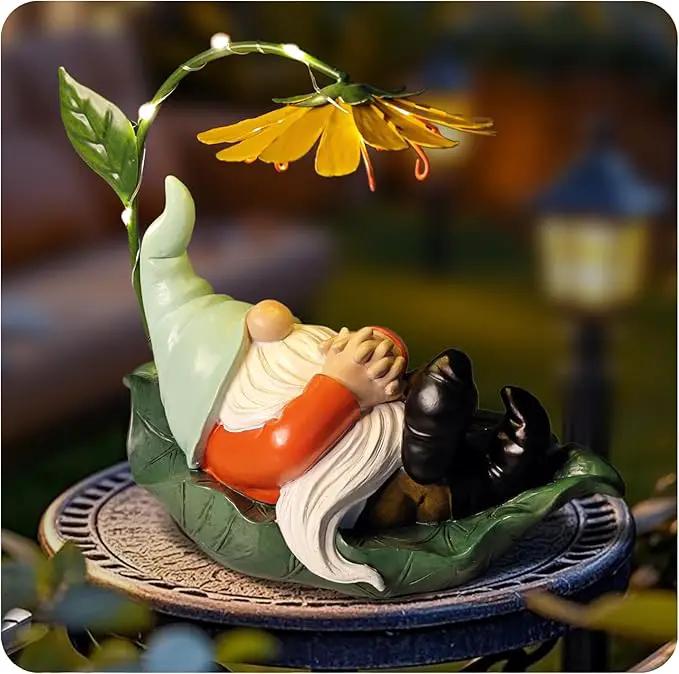 Solar Powered Gnome Garden Statue - Resin Gnome on Green Leaf with Large Yellow Stamen Sunshade, LED Lights Decorations, for Women Men, Outdoor Decor Ornaments for Outside by GreenHaven Gardens