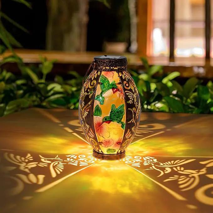 Hanging Solar Lantern Outdoor Waterproof Glass Solar Hummingbird Flickering Flame LED Garden Lights Metal Hollowed-Out Table Lamps Garden Decorations for Yard Patio Pathway Tabletop Tree Holiday by GreenHaven Gardens