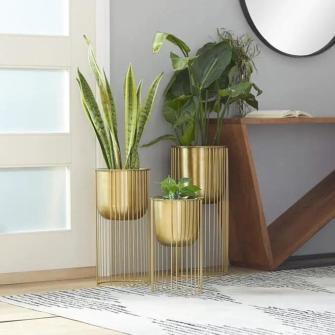 Deco 79 Metal Deep Recessed Dome Planter, Set of 3 24", 20", 16" H, Gold & CosmoLiving by Cosmopolitan Metal Indoor Outdoor Dome Planter with Removable Stand, Set of 2 19", 22" H, Gold by GreenHaven Gardens