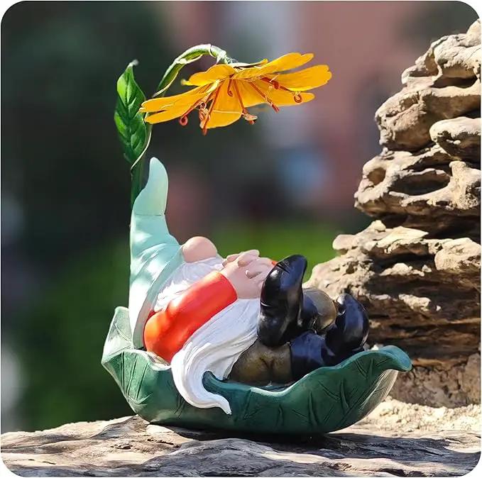 Solar Powered Gnome Garden Statue - Resin Gnome on Green Leaf with Large Yellow Stamen Sunshade, LED Lights Decorations, for Women Men, Outdoor Decor Ornaments for Outside by GreenHaven Gardens