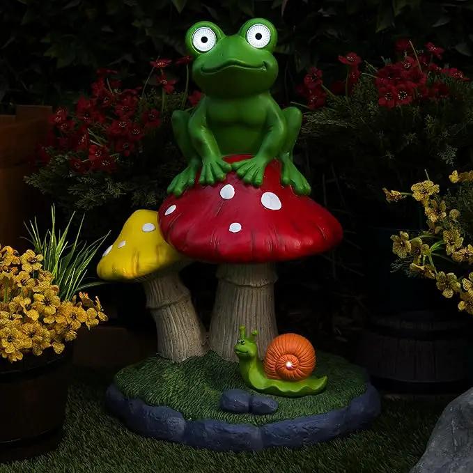 Alpine Corporation ZEN390SLR-L Frog on Mushroom Statue with LED Lights, Solar-Powered LED Frog Garden Statue, 24" H, Green by GreenHaven Gardens