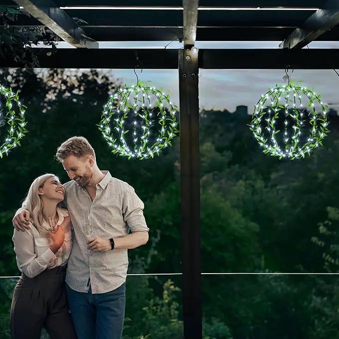 Solar Powered Hanging Iron Sphere Lights with Artificial Greenery – 12Inch 120 LED Waterproof Outdoor Decor Ball Light with Timer & 8 Modes – 2 Pack for Garden, Christmas, Weddings (Cool White) by GreenHaven Gardens