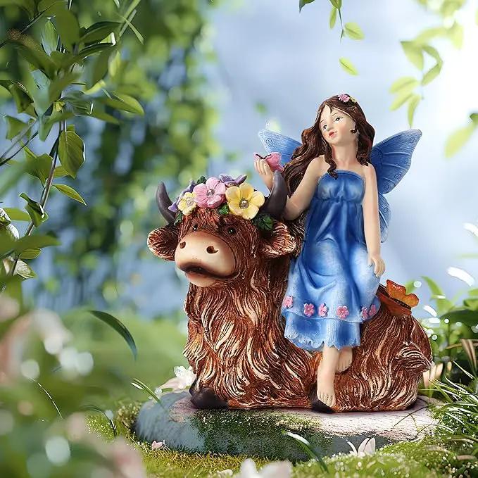 Solar Angel Garden Statue - Garden Fairy Sitting on a Highland Cow with Flowers, Butterflies and 5 LED Lights - Decorate Table, Terrace, Lawn, Birthdays, Grandma, mom by GreenHaven Gardens