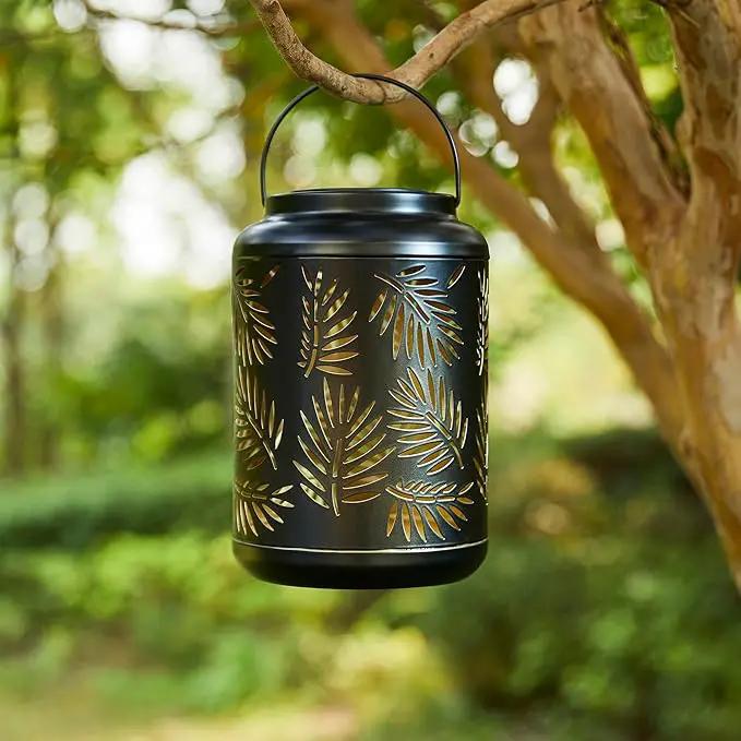 Glitzhome Solar Lantern Black Metal Cutout Leaf Outdoor Hanging Solar Light with Handle for Garden Patio Yard Outdoor Decor by GreenHaven Gardens