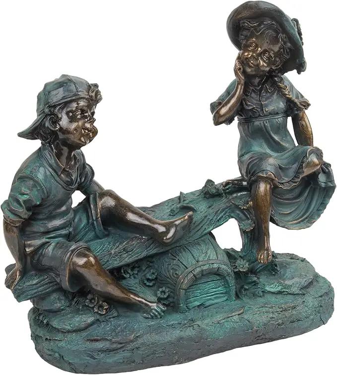Alpine Corporation 14" Tall Indoor/Outdoor Girl and Boy Playing on Teeter Totter Statue Yard Art Decoration by GreenHaven Gardens