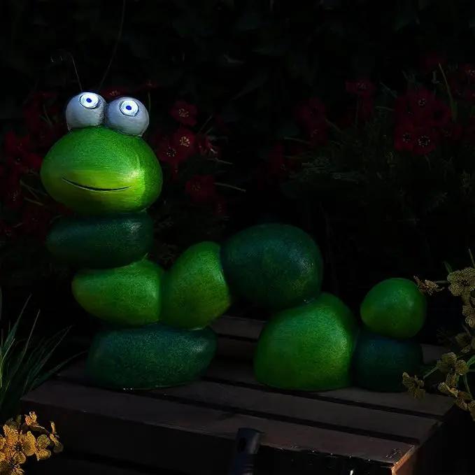 Alpine Corporation YEN608SLR Caterpillar Statue with Light Up Eyes, Solar Powered LED Caterpillar Garden Statue, 16" H, Green by GreenHaven Gardens