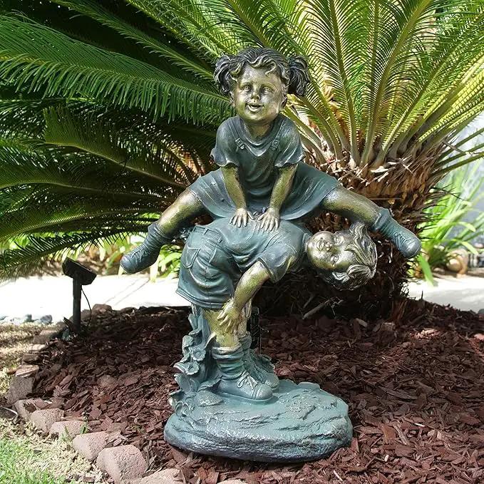 Alpine Corporation 26" Tall Indoor/Outdoor Girl Jumping Over Boy Statue Yard Art Decoration by GreenHaven Gardens