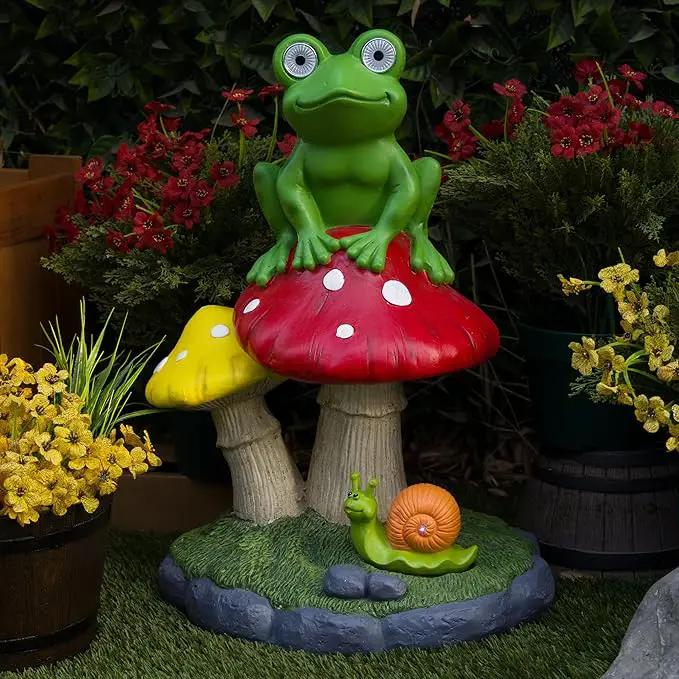Alpine Corporation ZEN390SLR-L Frog on Mushroom Statue with LED Lights, Solar-Powered LED Frog Garden Statue, 24" H, Green by GreenHaven Gardens