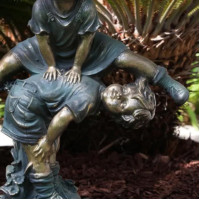Alpine Corporation 26" Tall Indoor/Outdoor Girl Jumping Over Boy Statue Yard Art Decoration by GreenHaven Gardens