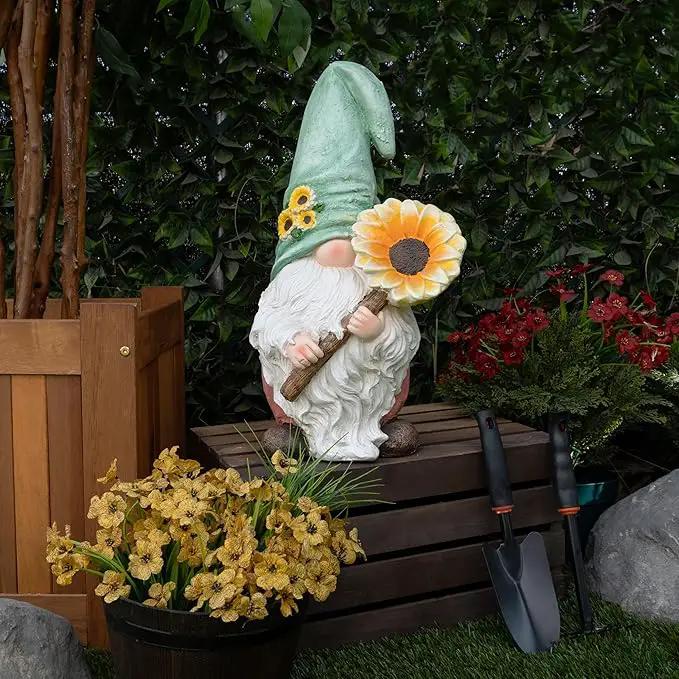 Alpine Corporation MCC842 Indoor/Outdoor Gnome Holding Sunflower Garden Statue, Charming Gnome Statue w/Hat, 21" H, Turquoise by GreenHaven Gardens