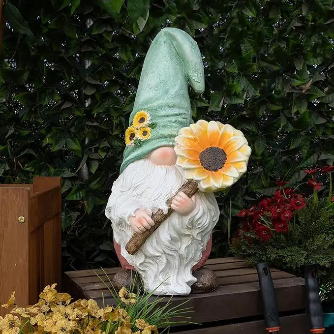 Alpine Corporation MCC842 Indoor/Outdoor Gnome Holding Sunflower Garden Statue, Charming Gnome Statue w/Hat, 21" H, Turquoise by GreenHaven Gardens