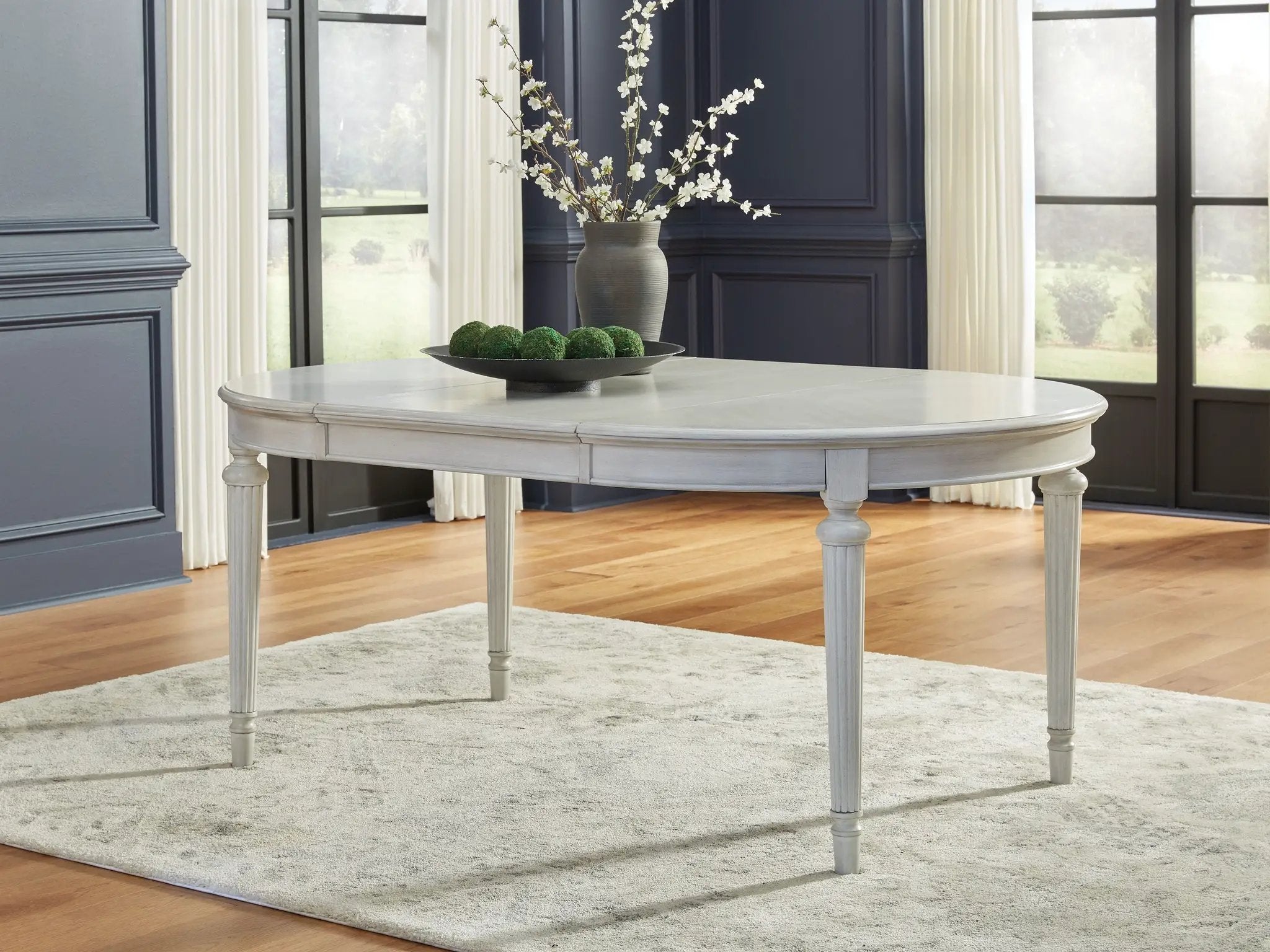 Montelaine - Oval Dining Room Extension Table - Antique White by Unique Piece Furniture