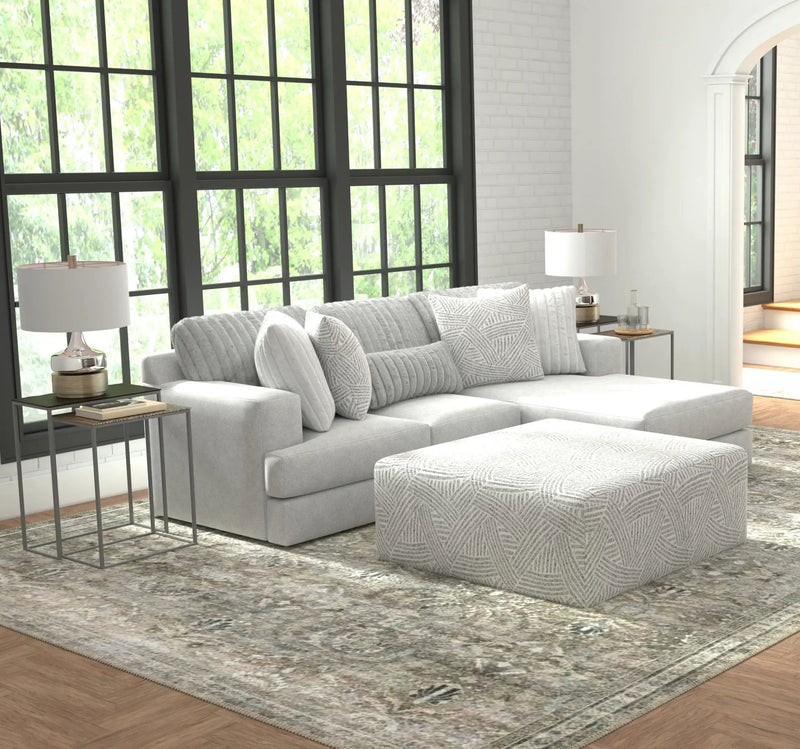 Logan - Upholstered Sectional With Comfort Coil Seating - 46" Cocktail Ottoman And Accent Pillows Included by Unique Piece Furniture