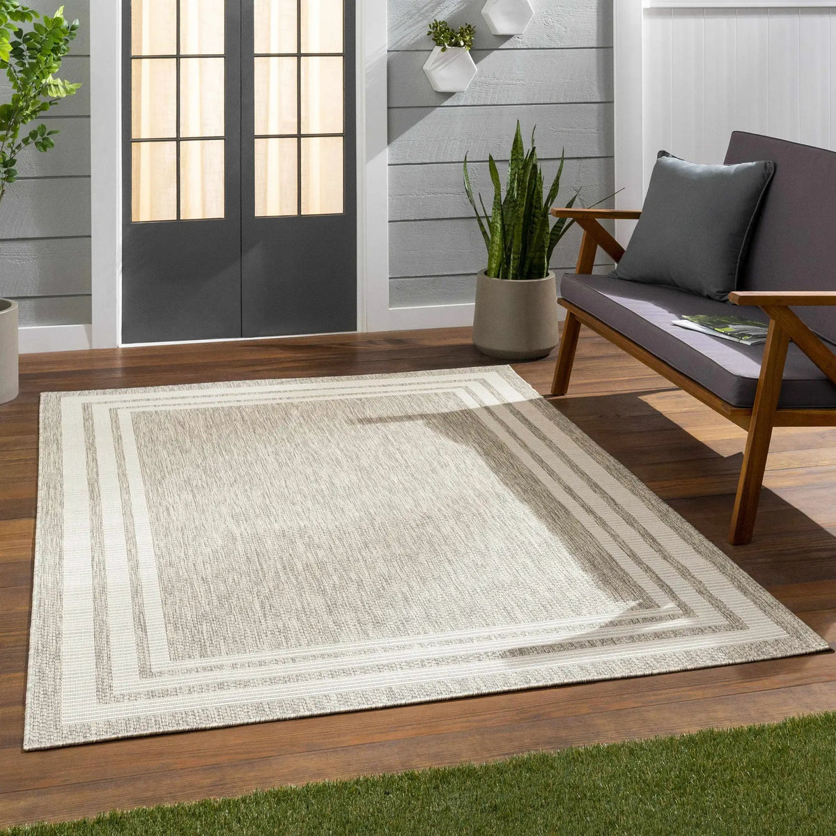Burradoo Bordered Outdoor Area Rug, installed in a room 3