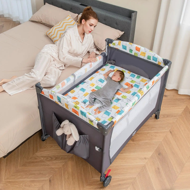 5-in-1 Baby Nursery Center Foldable Toddler Bedside Crib with Music Box by DirectDeals