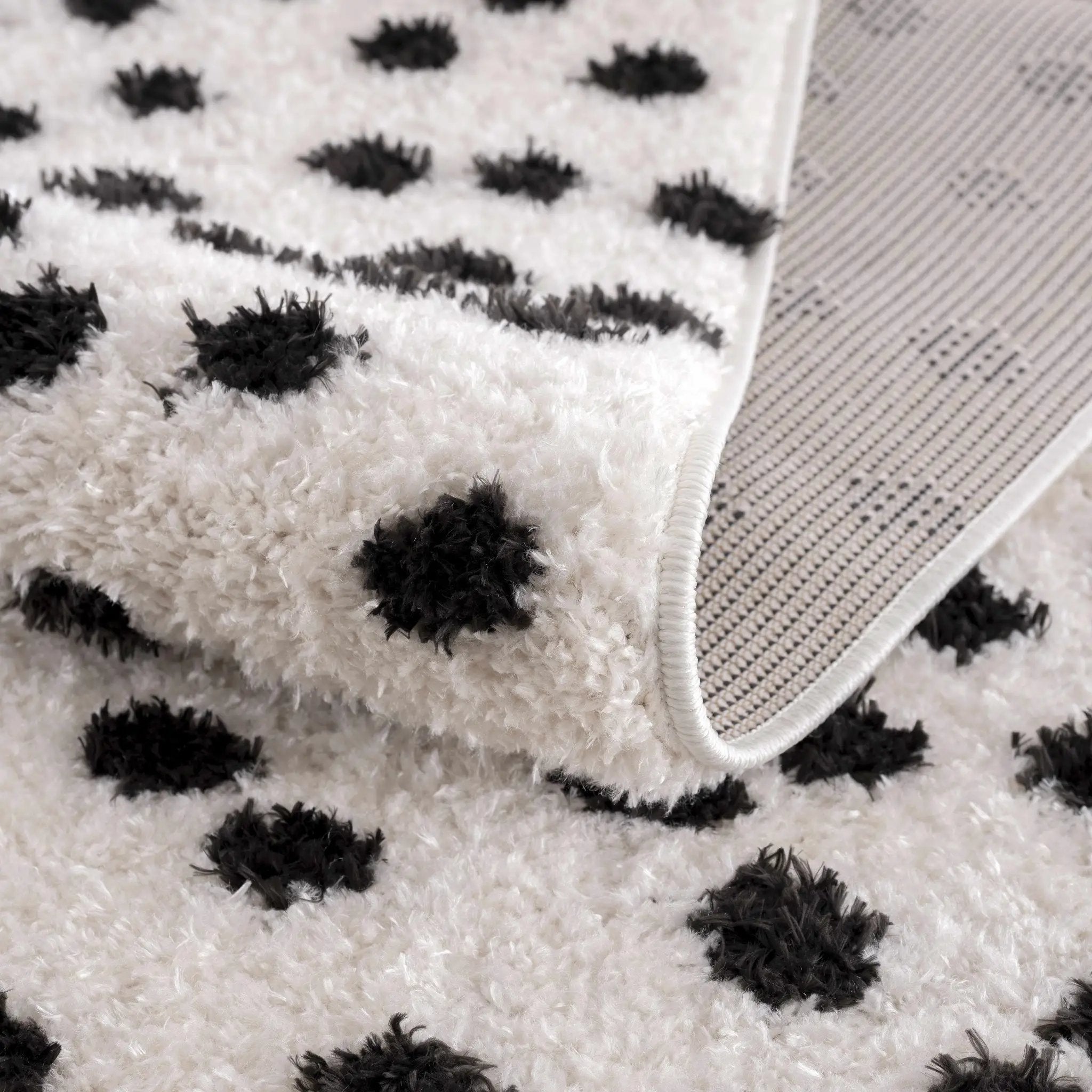 Cansu Black & White Dotted Area Rug by Hauteloom