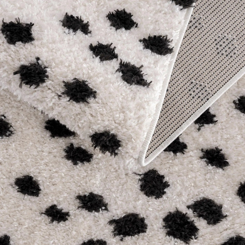 Cansu Black & White Dotted Area Rug by Hauteloom