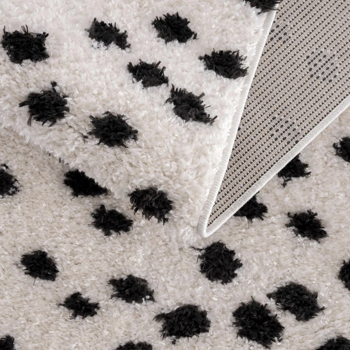 Cansu Black & White Dotted Area Rug, photo 9 of 19