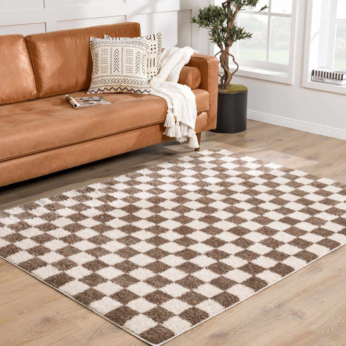 Canika Brown Washable Checkered Area Rug, installed in a room