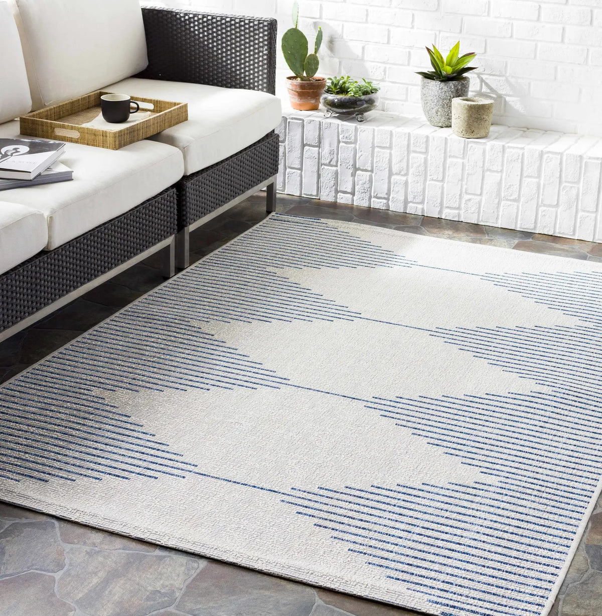 Stephan Blue & Cream Outdoor Rug, installed in a room