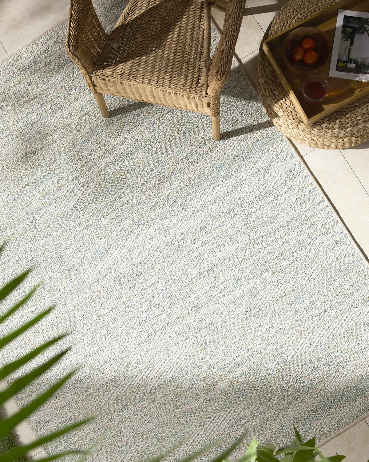 Alezae Ivory Outdoor Area Rug, installed in a room
