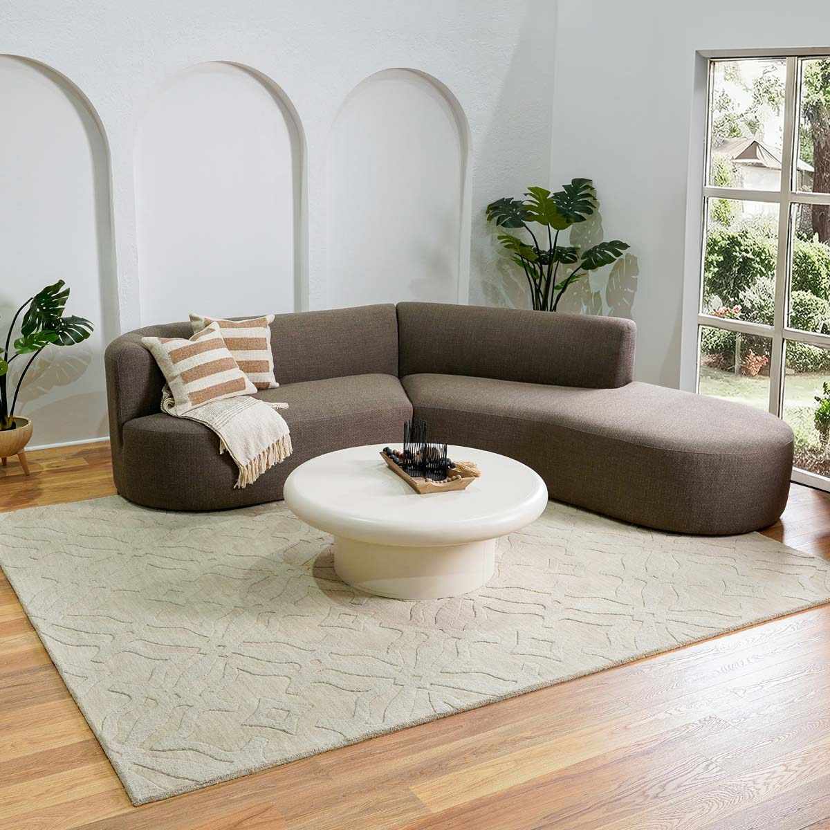 Fyffe Embossed Beige Wool Area Rug, installed in a room