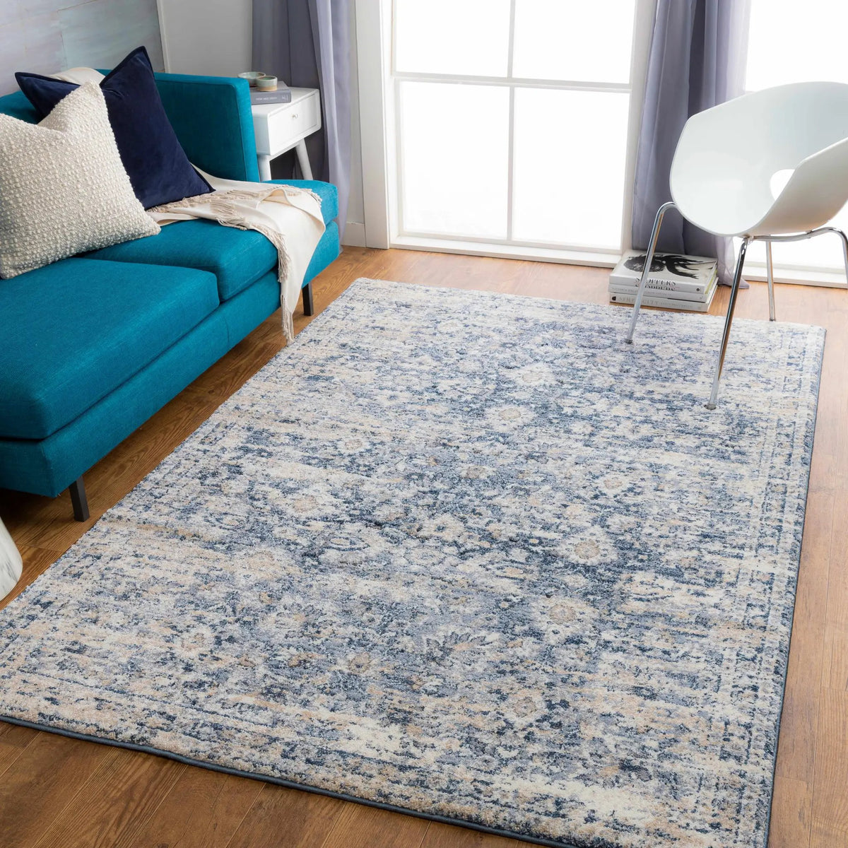 Talihina Denim Damask Area Rug, installed in a room