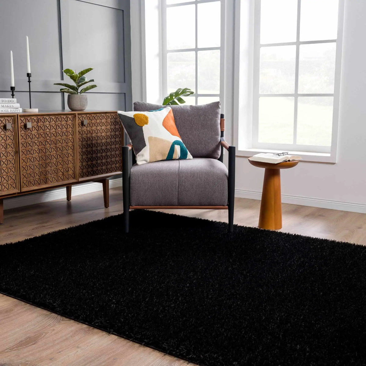 Faina Solid Black Shag Washable Area Rug - Clearance, installed in a room