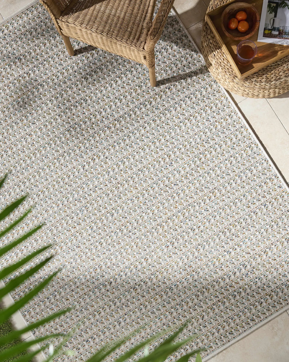 Ataret Ivory Outdoor Area Rug, installed in a room