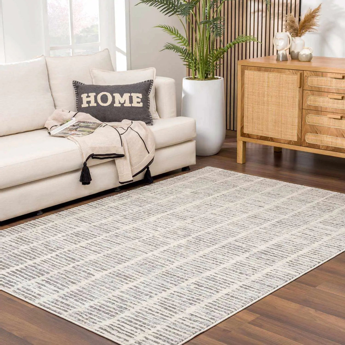 Aricin Gray Area Rug, installed in a room