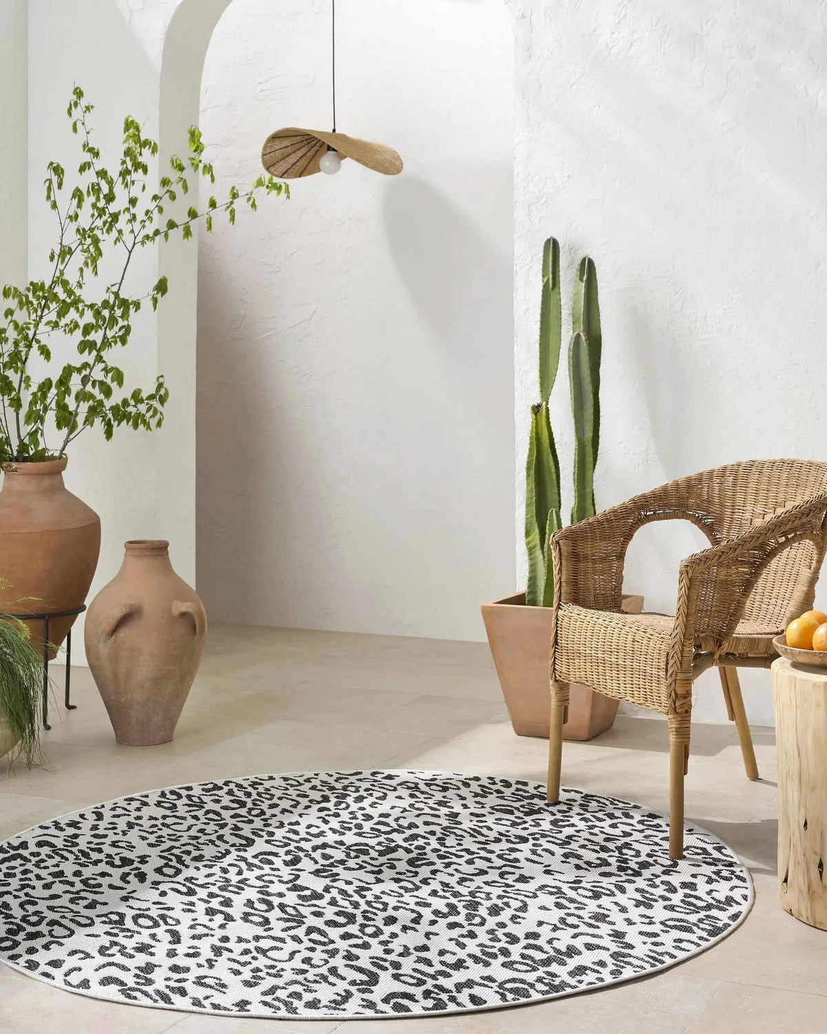 Alderbury White Leopard Print Outdoor Rug, installed in a room 3
