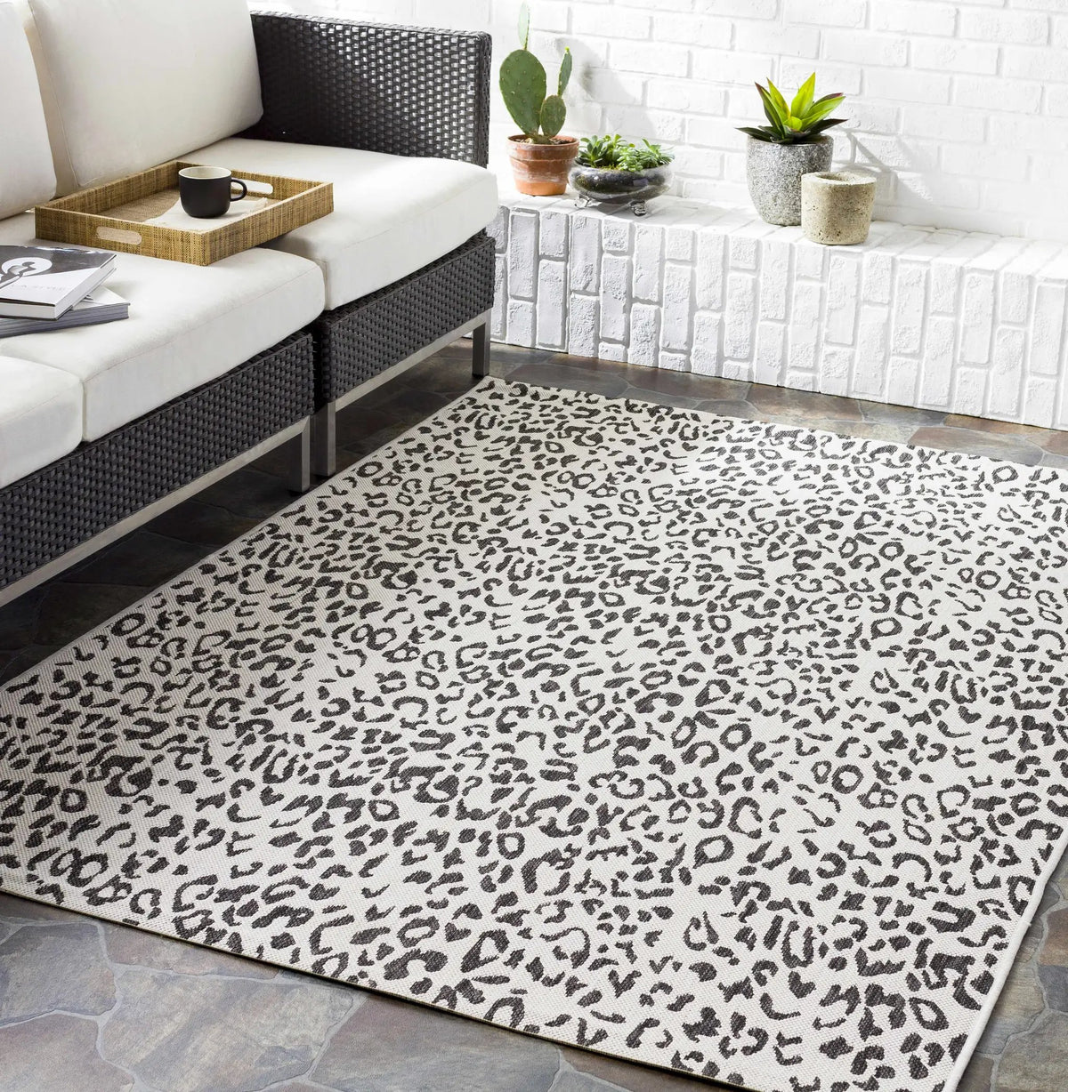 Alderbury White Leopard Print Outdoor Rug, installed in a room