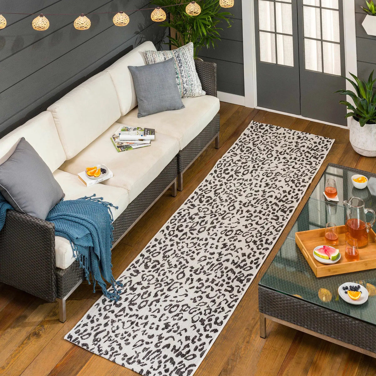 Alderbury White Leopard Print Outdoor Rug, installed in a room 2