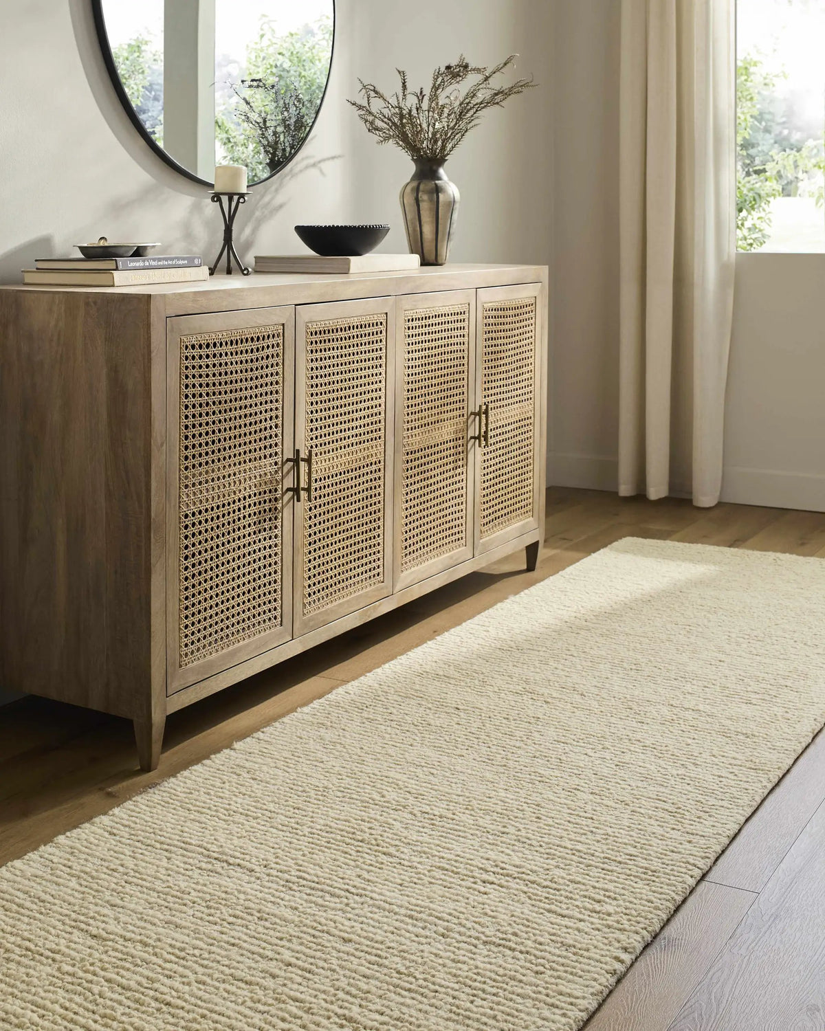 Winta Cream Wool Area Rug, installed in a room