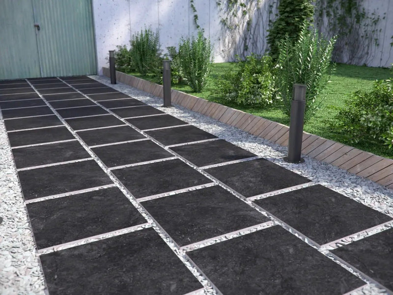 Vulkon Nero Matte Limestone Look Porcelain Pavers 24x24 in a finished room