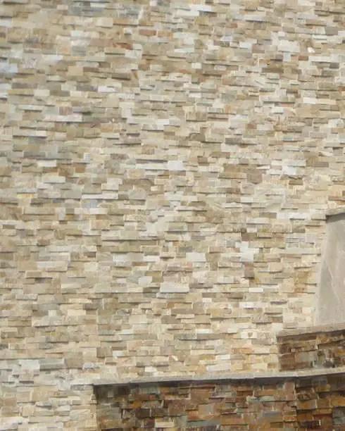 Golden Honey Split Face Quartzite Pavers 6x24 in a finished room