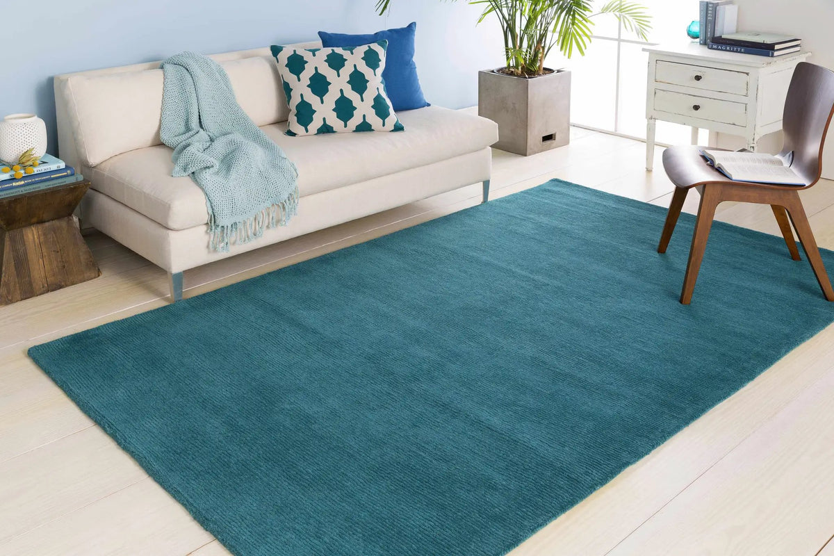 Brockton Solid Teal Wool Rug, installed in a room 2
