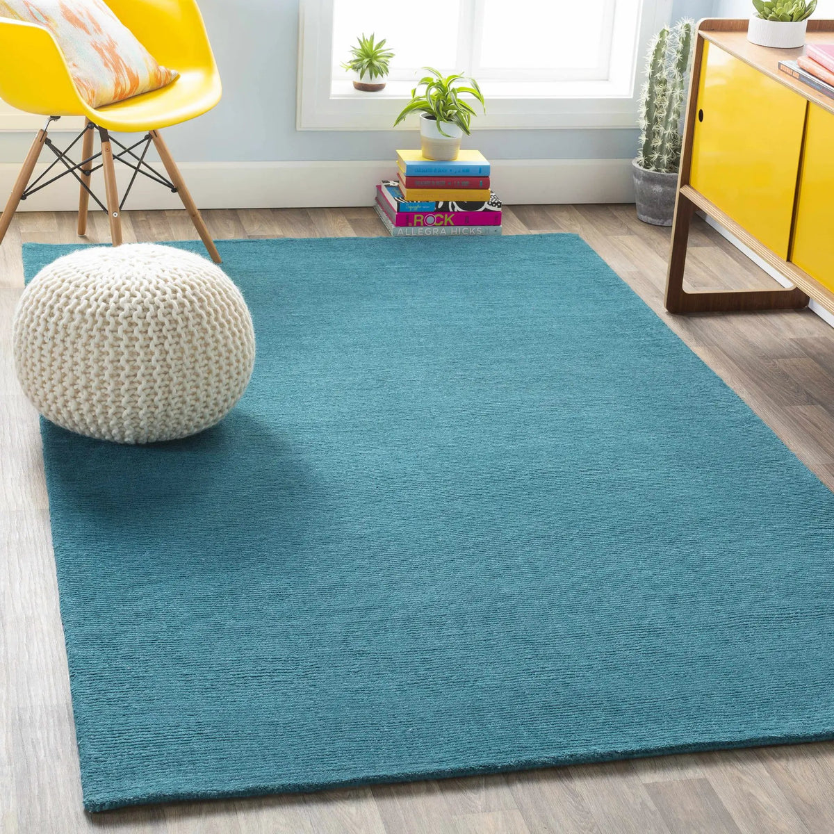 Brockton Solid Teal Wool Rug, installed in a room