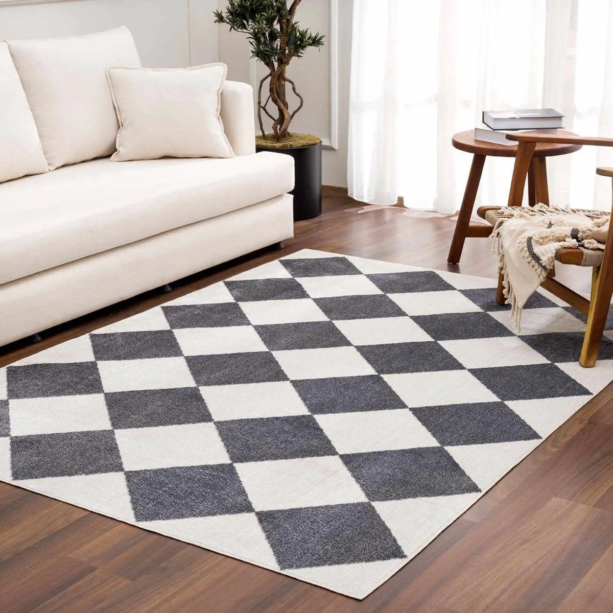Ulric Navy Blue Diamond Washable Area Rug, installed in a room