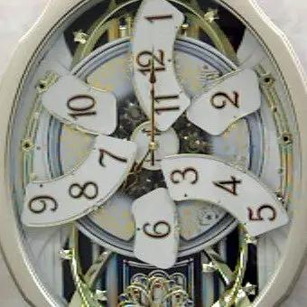 Moving Face Pendulum Wall Clock - Plays Melodies Every Hour by HomePacific