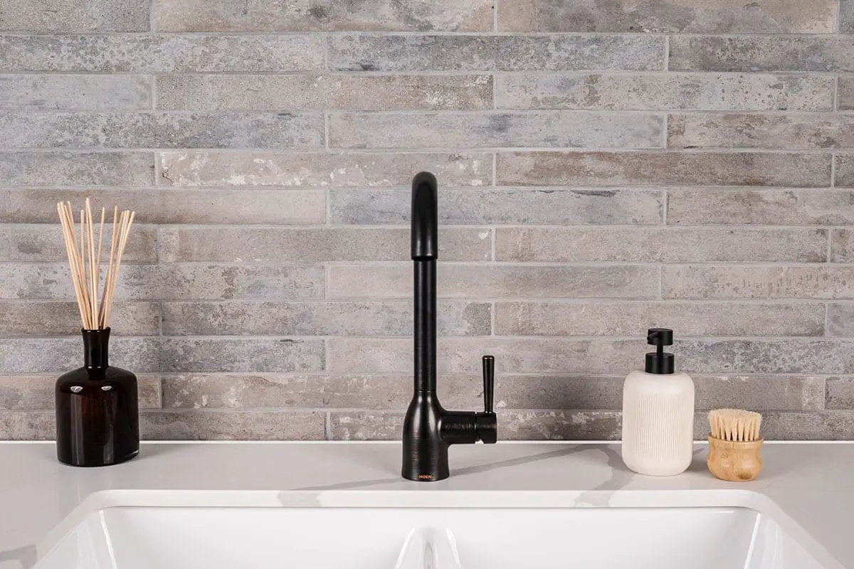 Brickstone Taupe Brick 2x18 Matte Porcelain Mosaics in a finished room