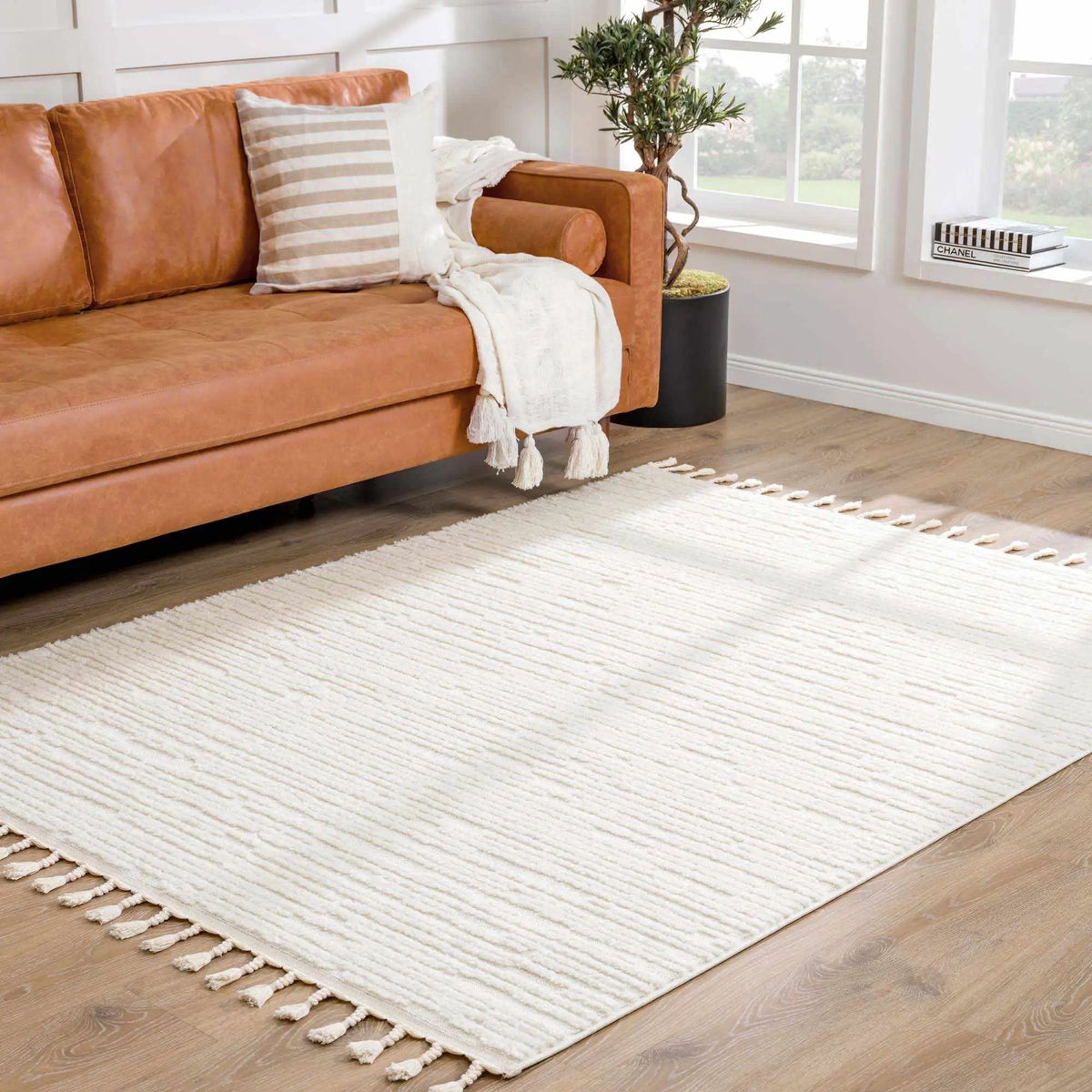 Kulu Textured Area Rug with Tassels, installed in a room 2